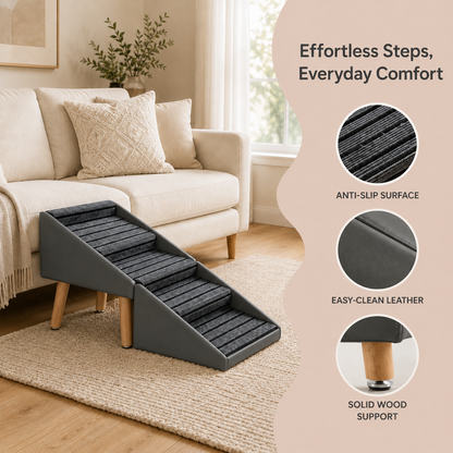 A pet ramp with dark gray textured steps and light wood legs, shown in a living room setting next to a beige sofa. The image includes feature callouts on the right side reading 'Effortless Steps, Everyday Comfort' with close-up texture and material details.