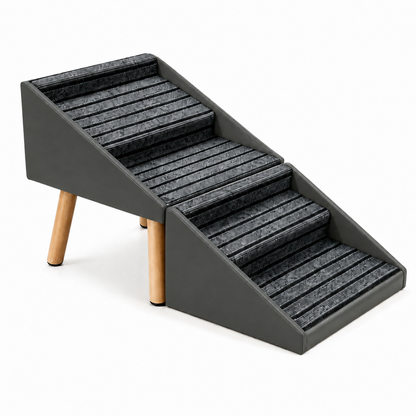 A three-step pet ramp with a dark gray frame and textured gray steps, supported by two natural wood legs, shown on a white background.